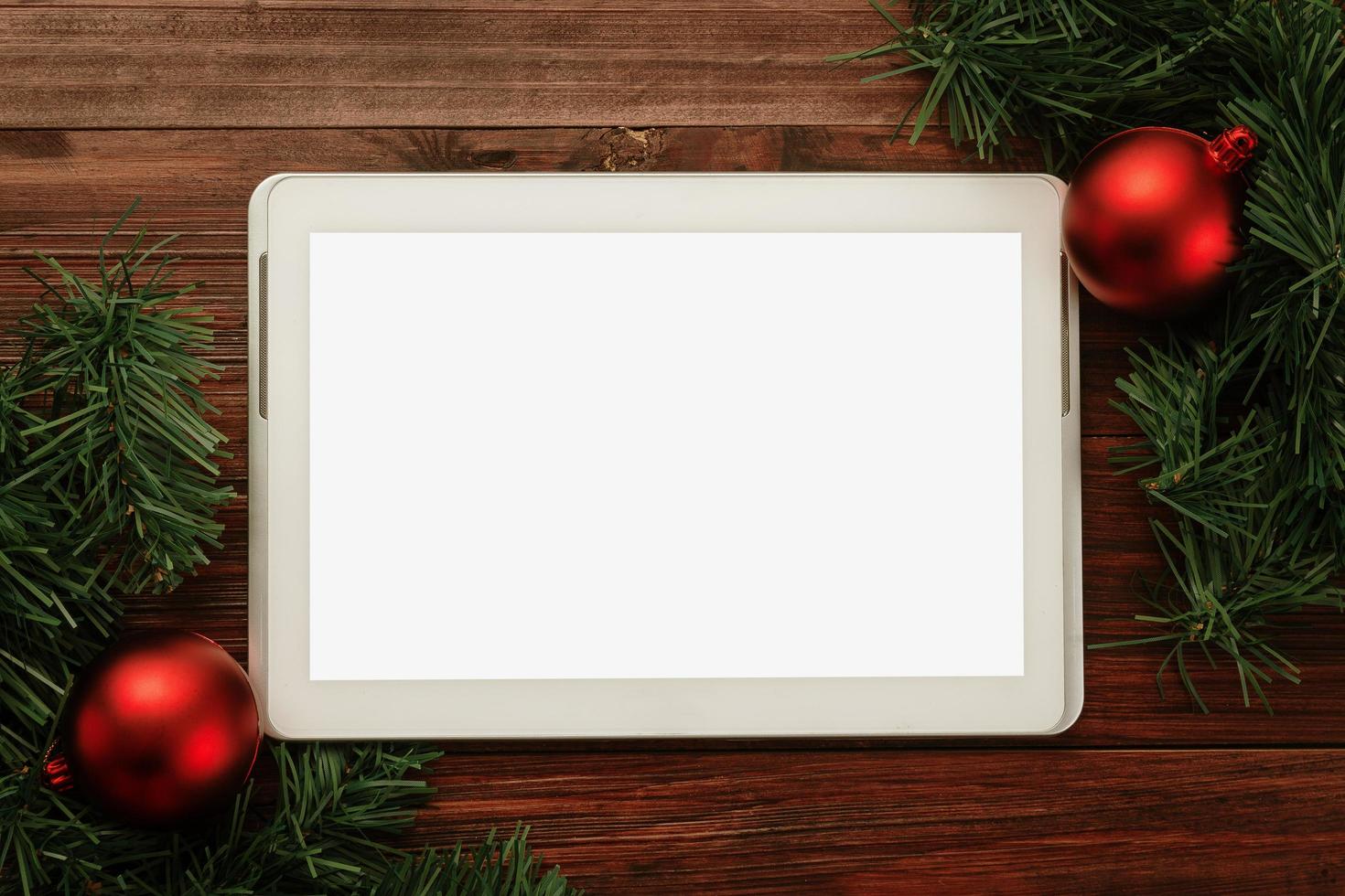 Tablet with Christmas decor mock-up photo