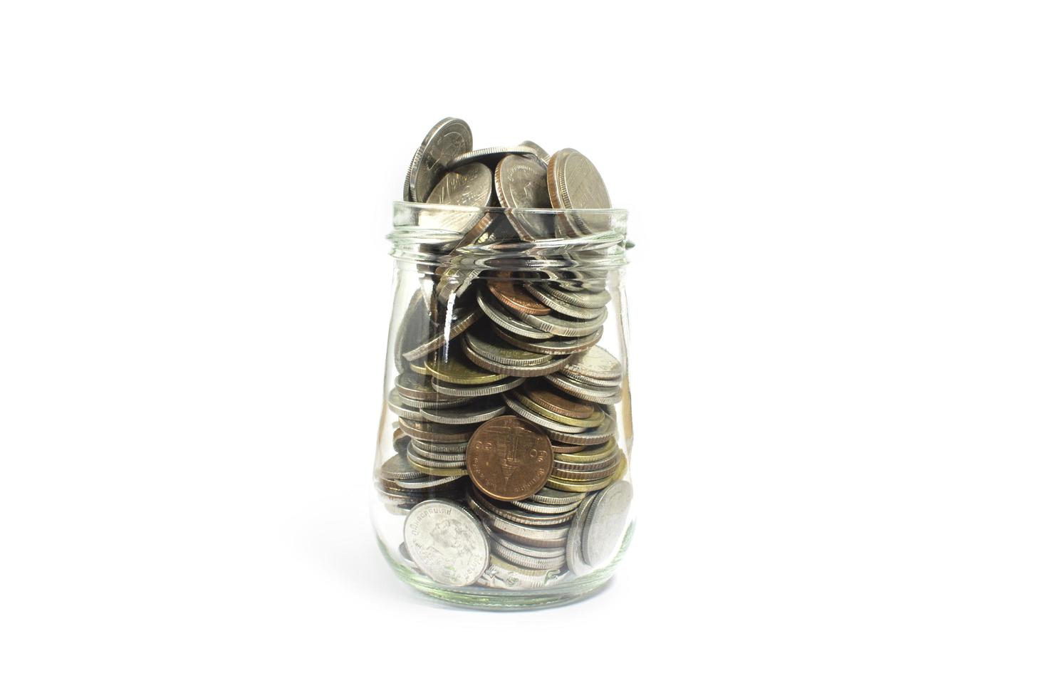 Jar filled with coins photo
