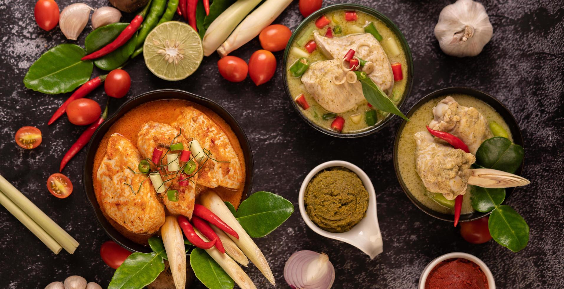 Chicken curry in a bowl with lemongrass lime, tomatoes and garlic photo