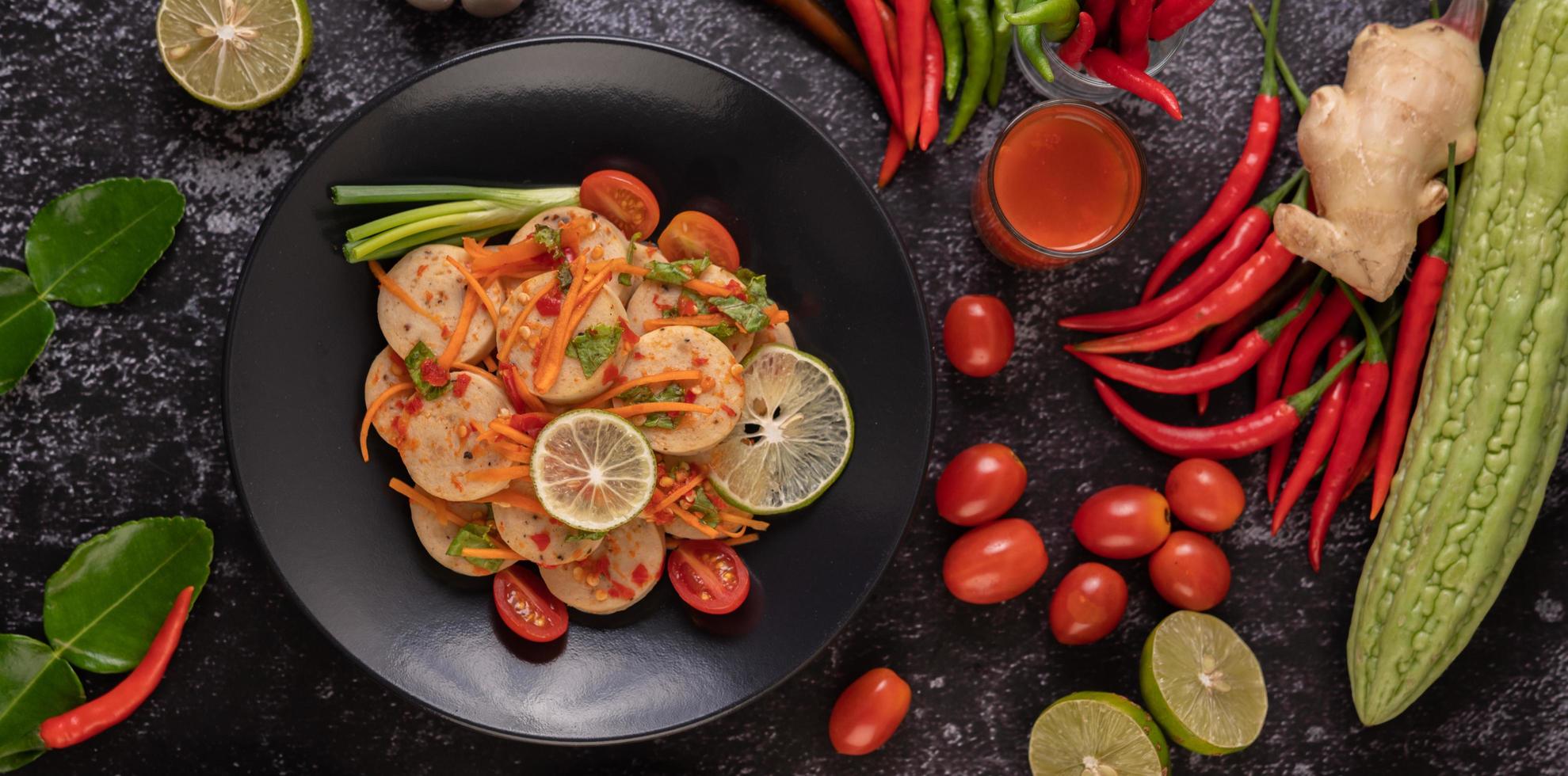 Vietnamese pork sausage salad with chilli, lemon, garlic and tomato photo