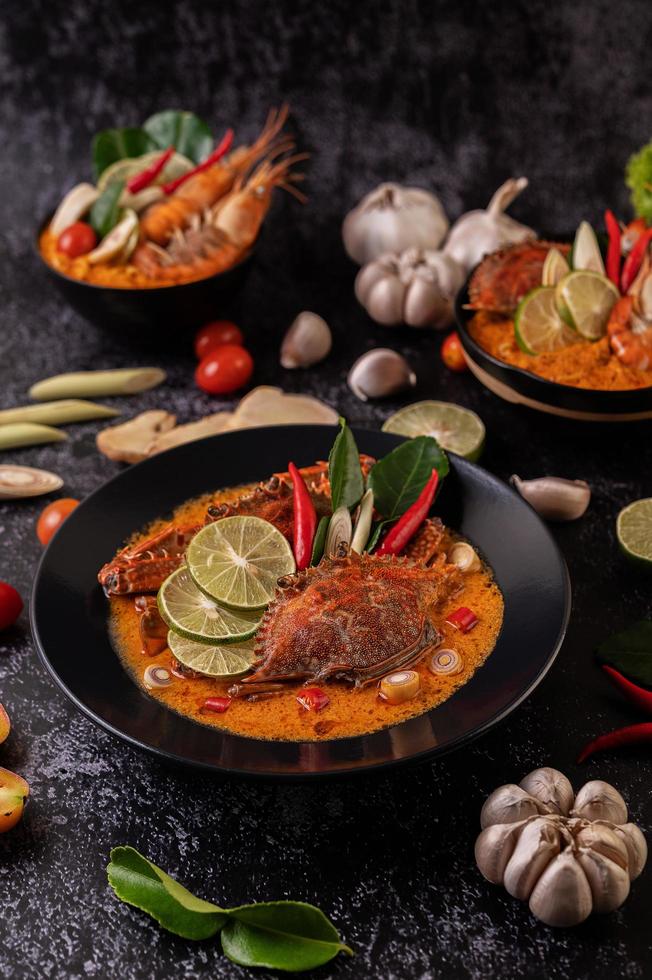 Tom yum crab with lemon, chili, tomato, garlic, lemongrass and kaffir lime photo