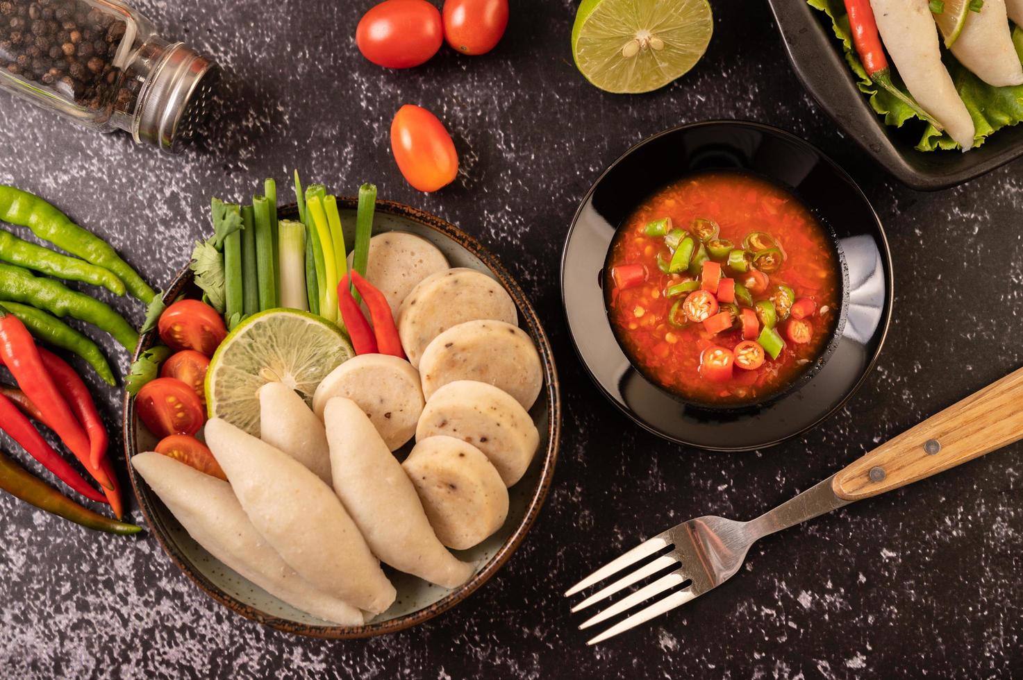 Rugby fish balls with lemon chili paste, tomato and chili photo