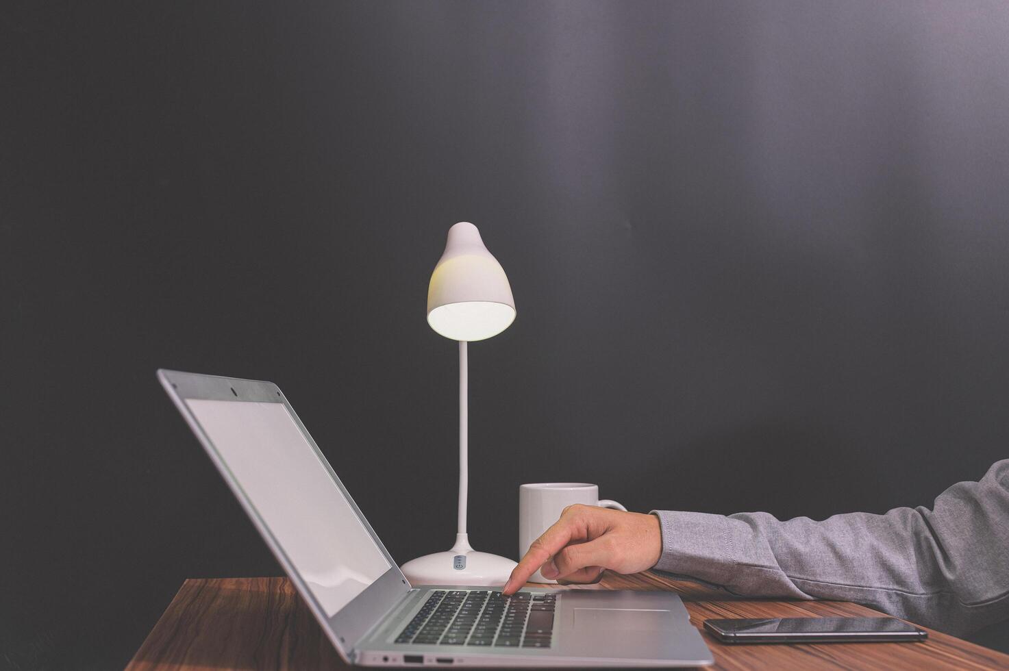 Person working on a laptop mock-up photo