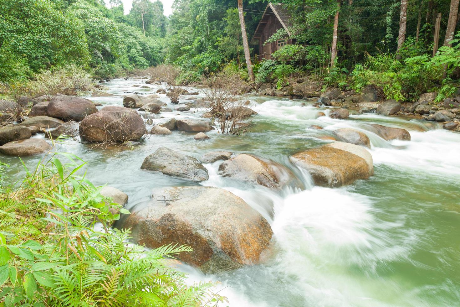 Stream flowing down from the mountain photo