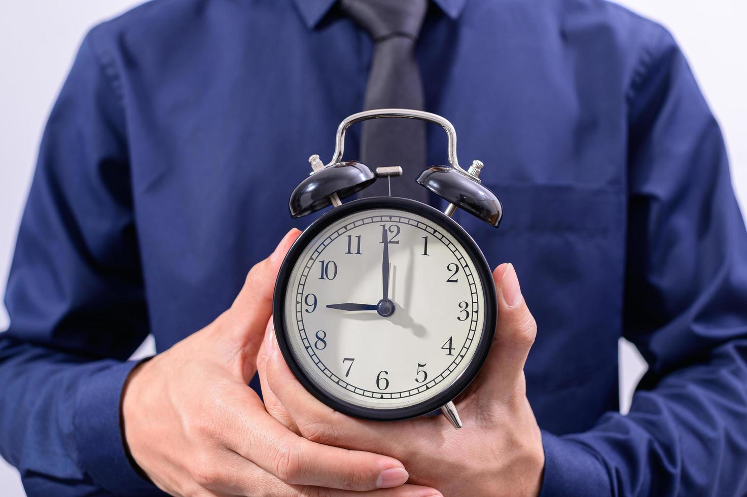 Professional holding a clock photo