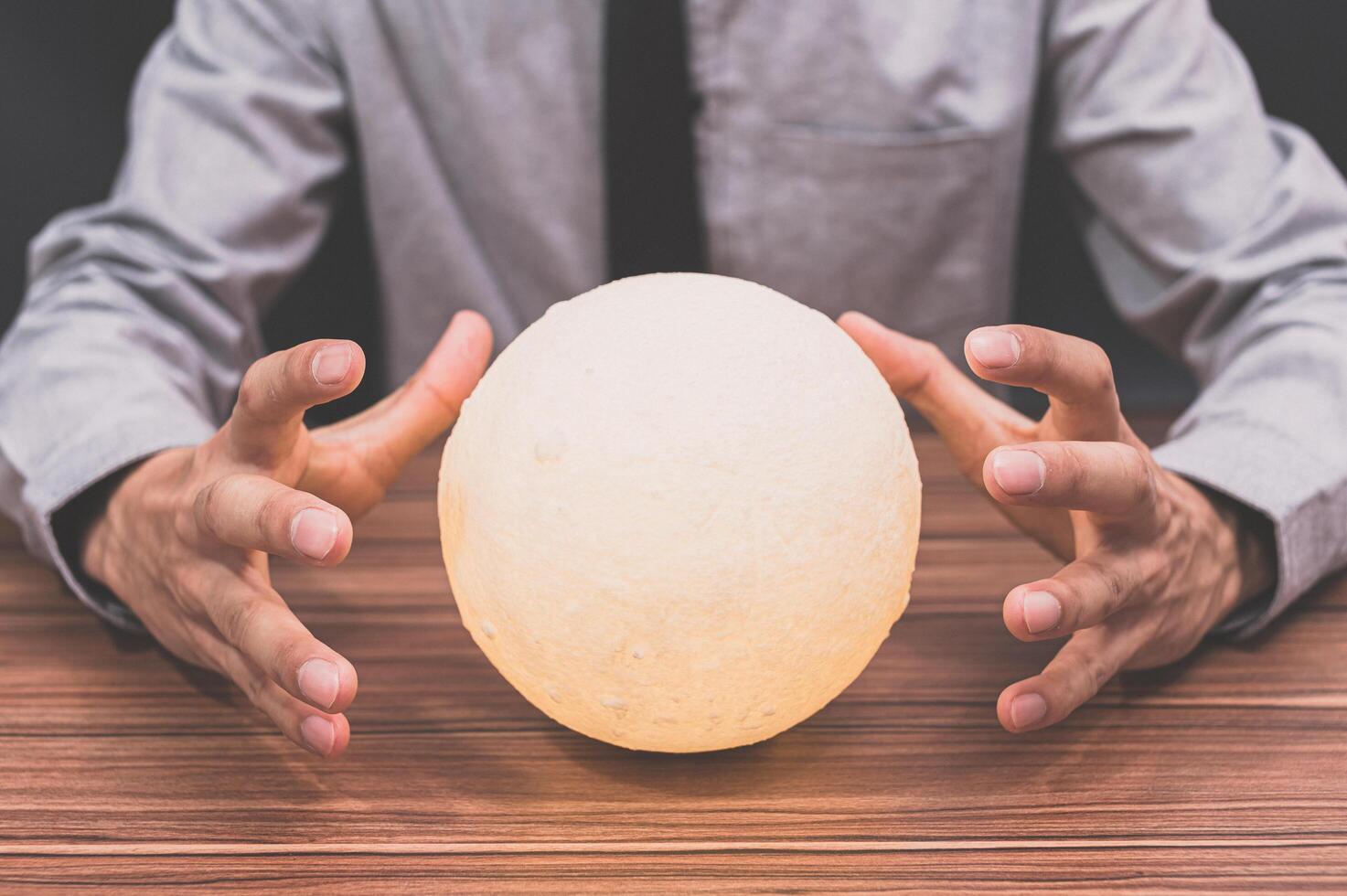 Man with moon lamp photo