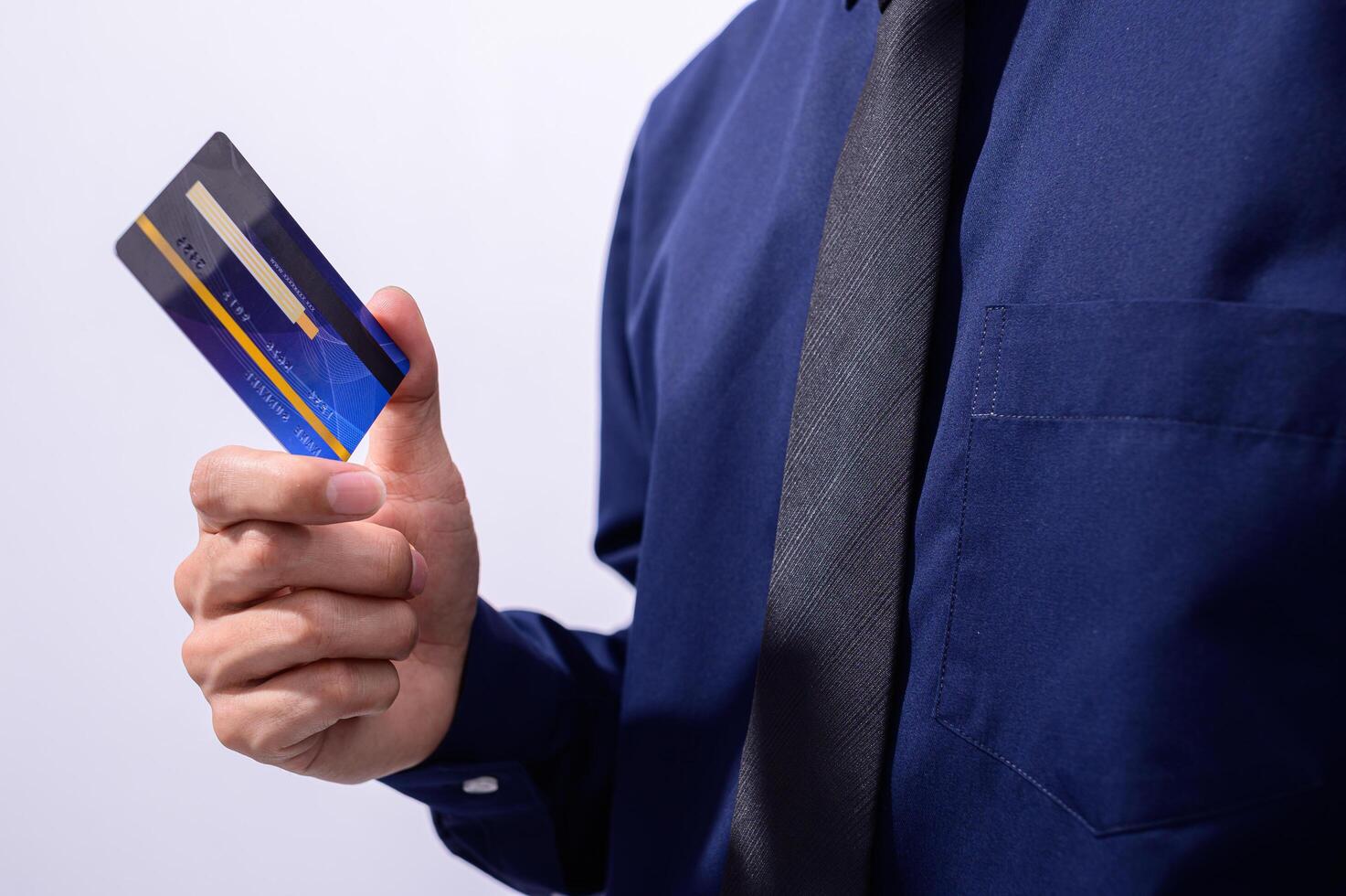 Business professional holding a credit card photo