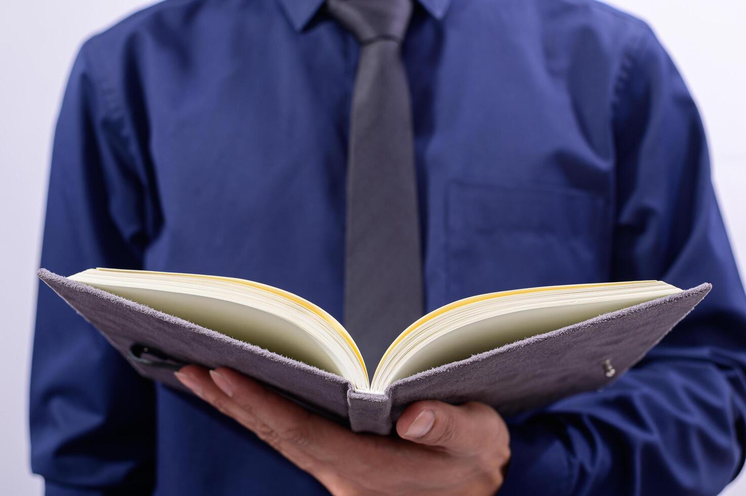 Professional holding an open book photo