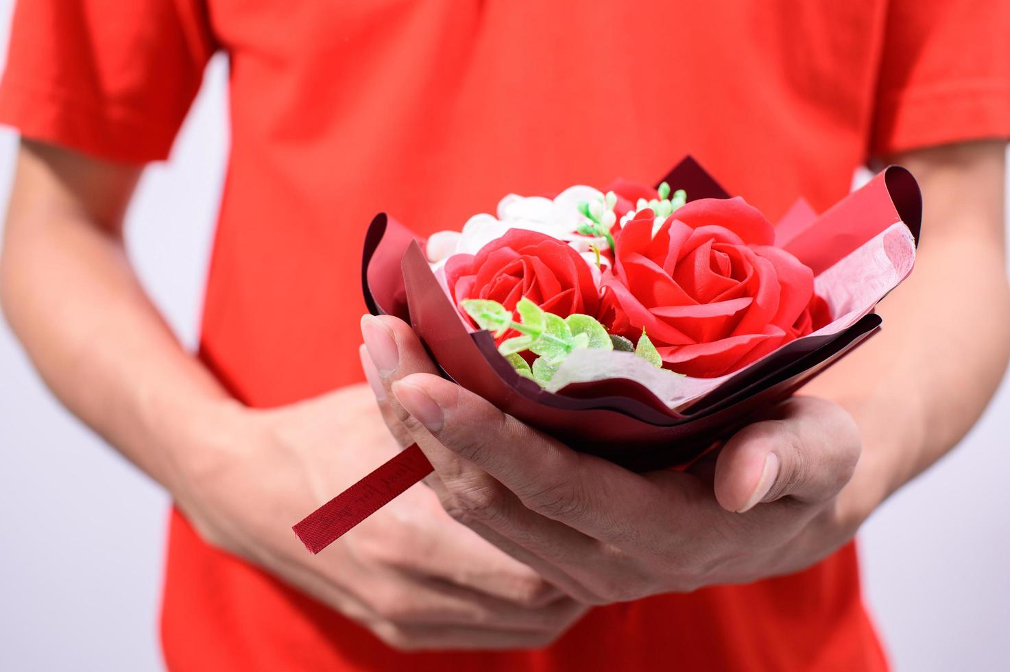 Person holding out a bouquet photo