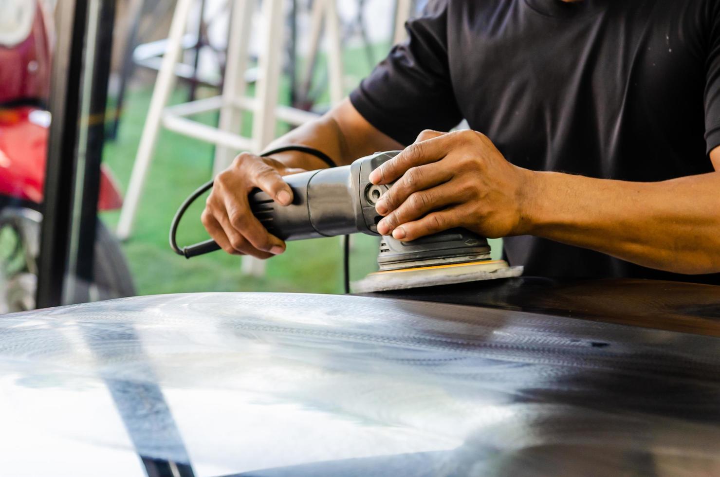 Polishing a car hood photo