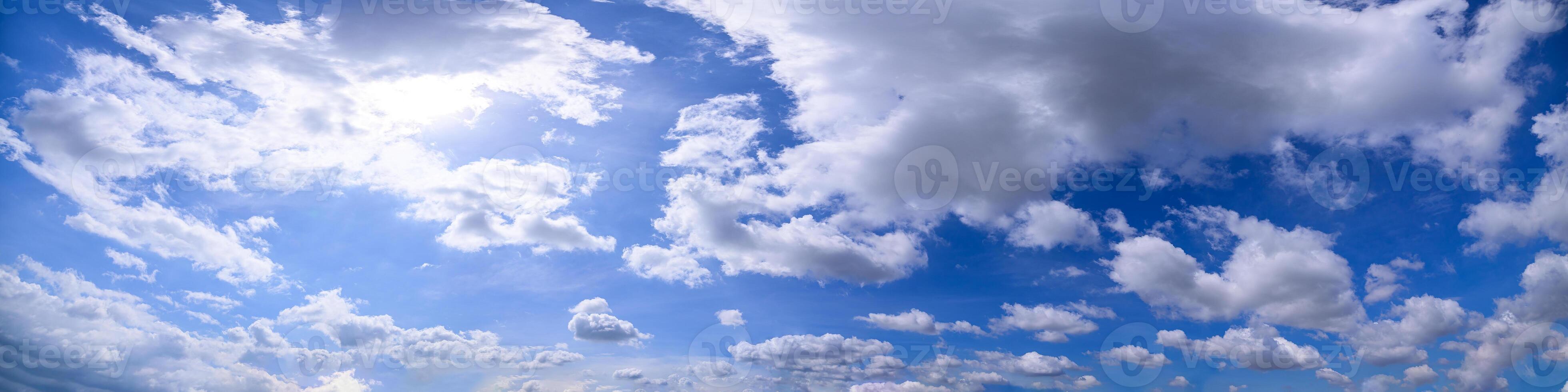 A view of the sky with clouds and sun photo
