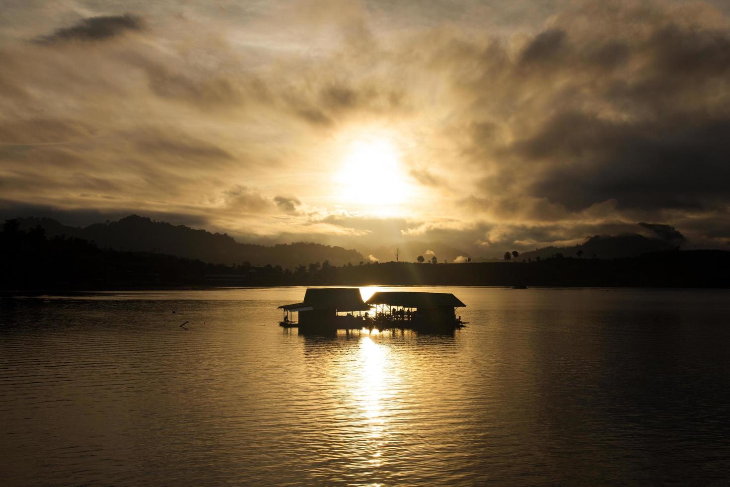 Silhouettes of river rafting photo