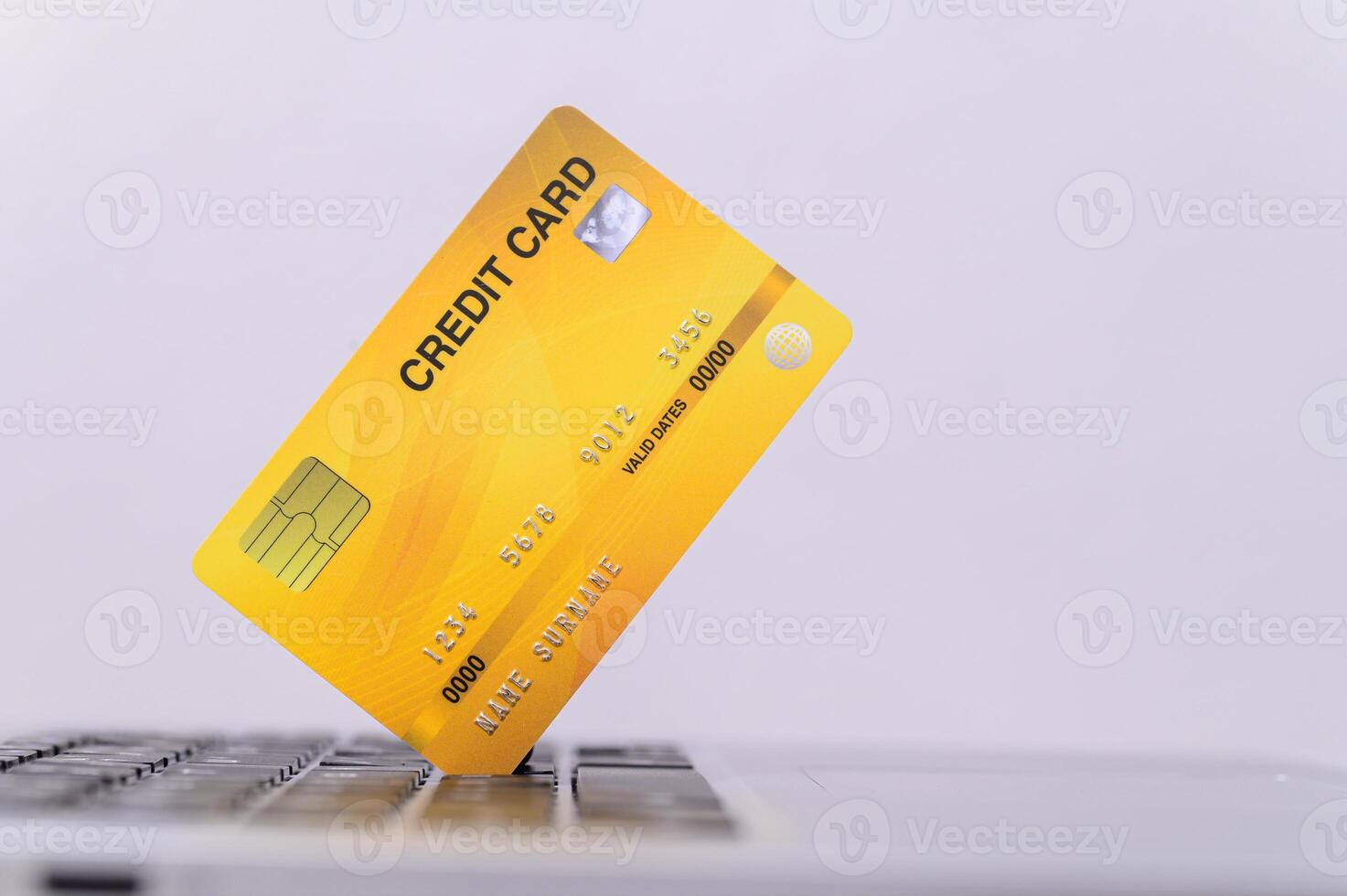 Credit card on laptop keyboard photo