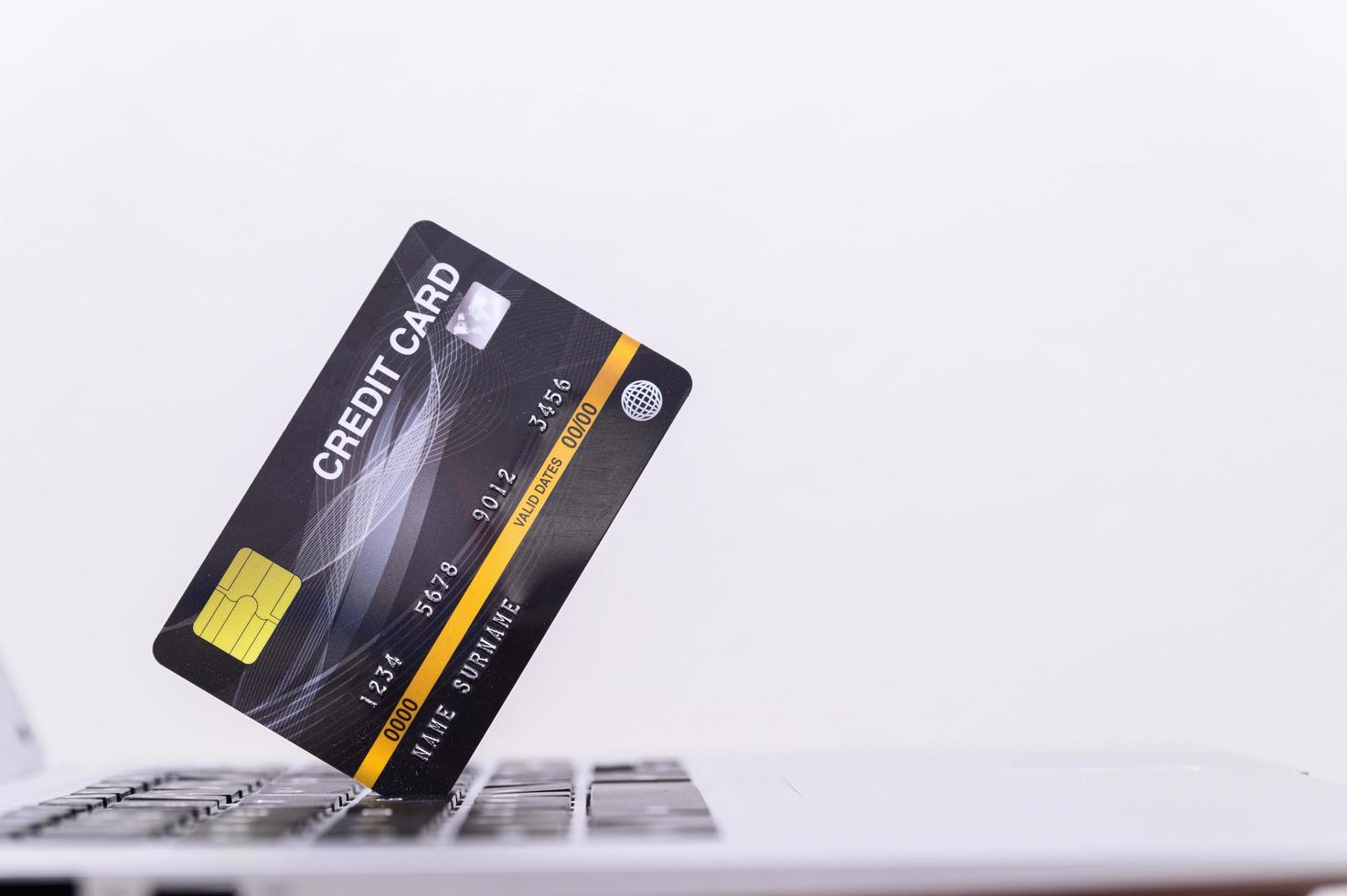 Black credit card on laptop photo