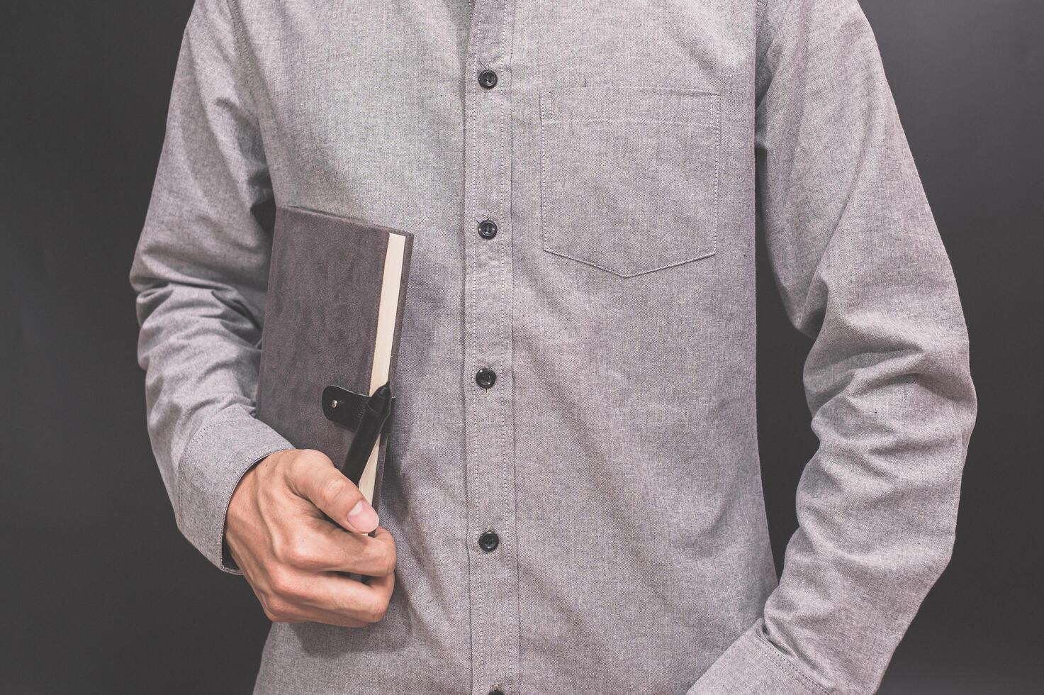 Person holding a notebook photo