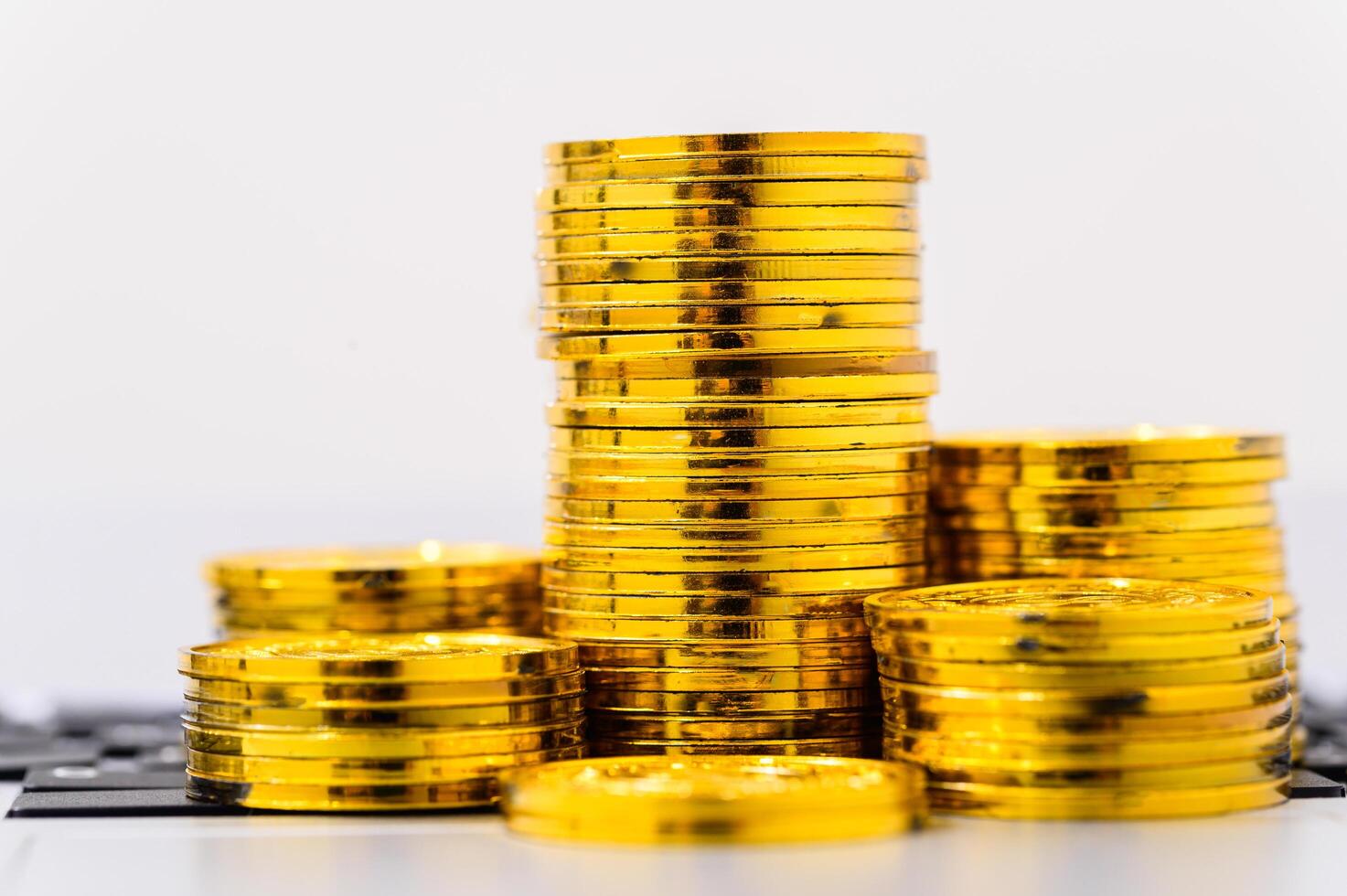 Stack of gold coins on white photo