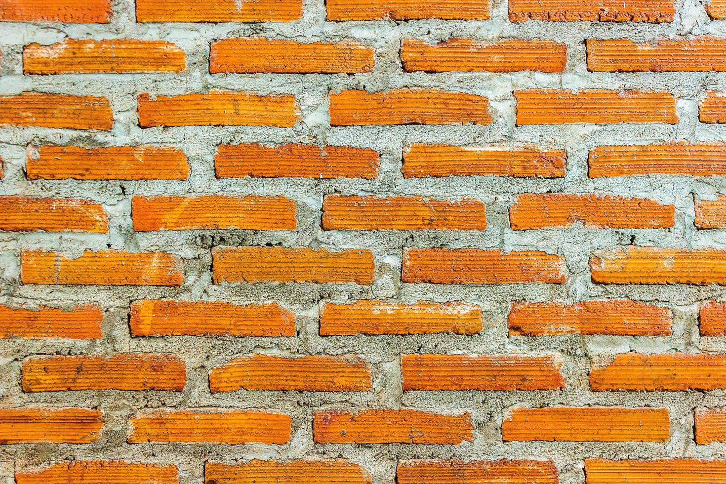 pared de ladrillo rojo para textura o fondo foto