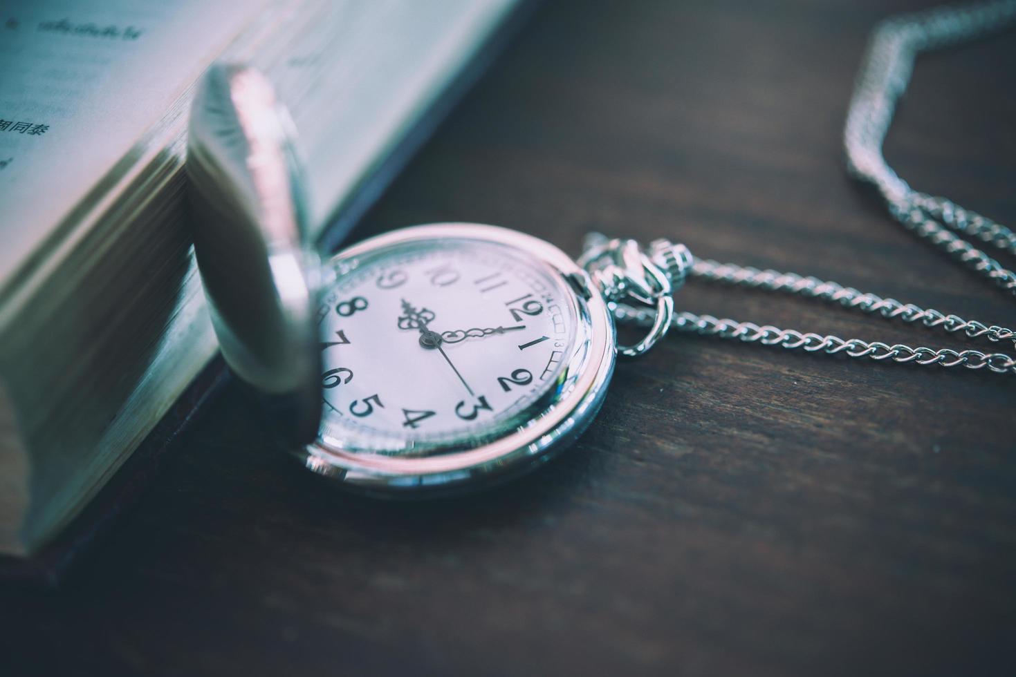 Vintage pocket watch, symbols of time with copy space photo