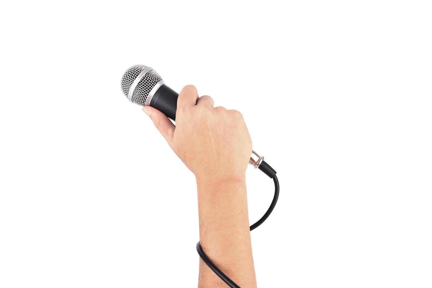 Hand holding mic on white background 1920258 Stock Photo at Vecteezy