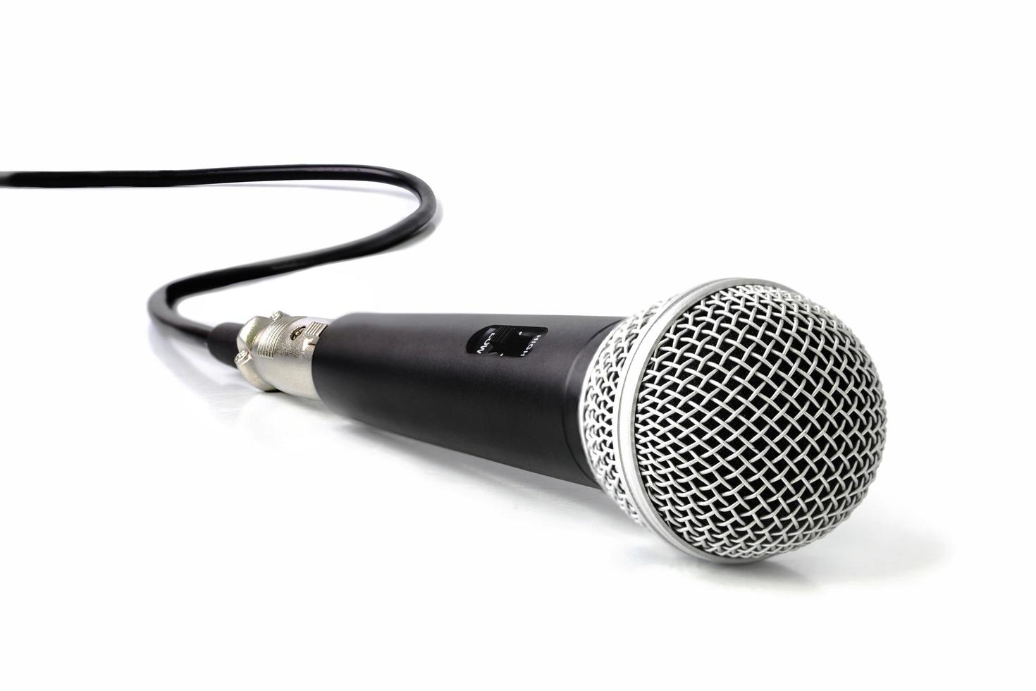 Black microphone on white background photo
