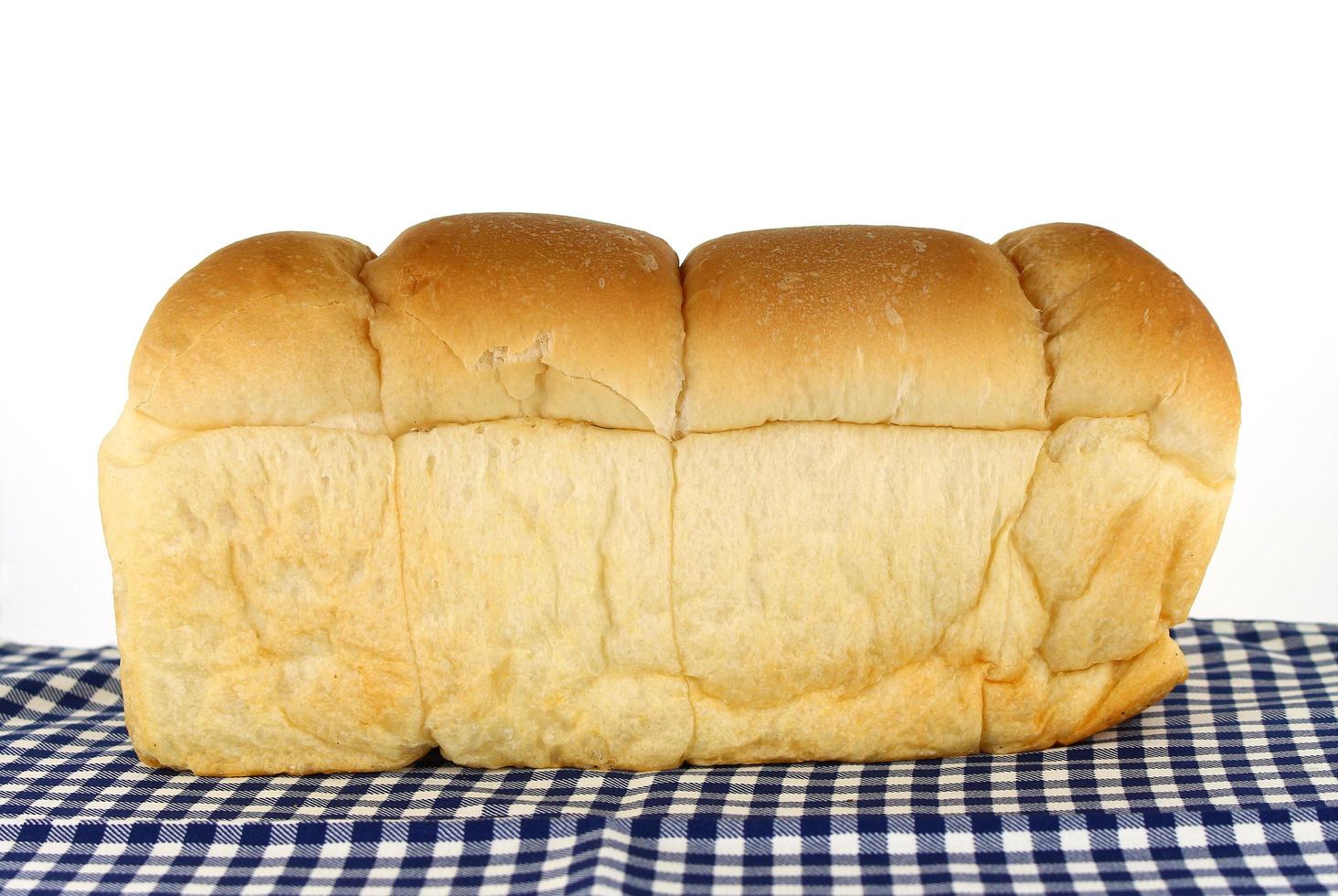 Bread loaf on blue cloth photo