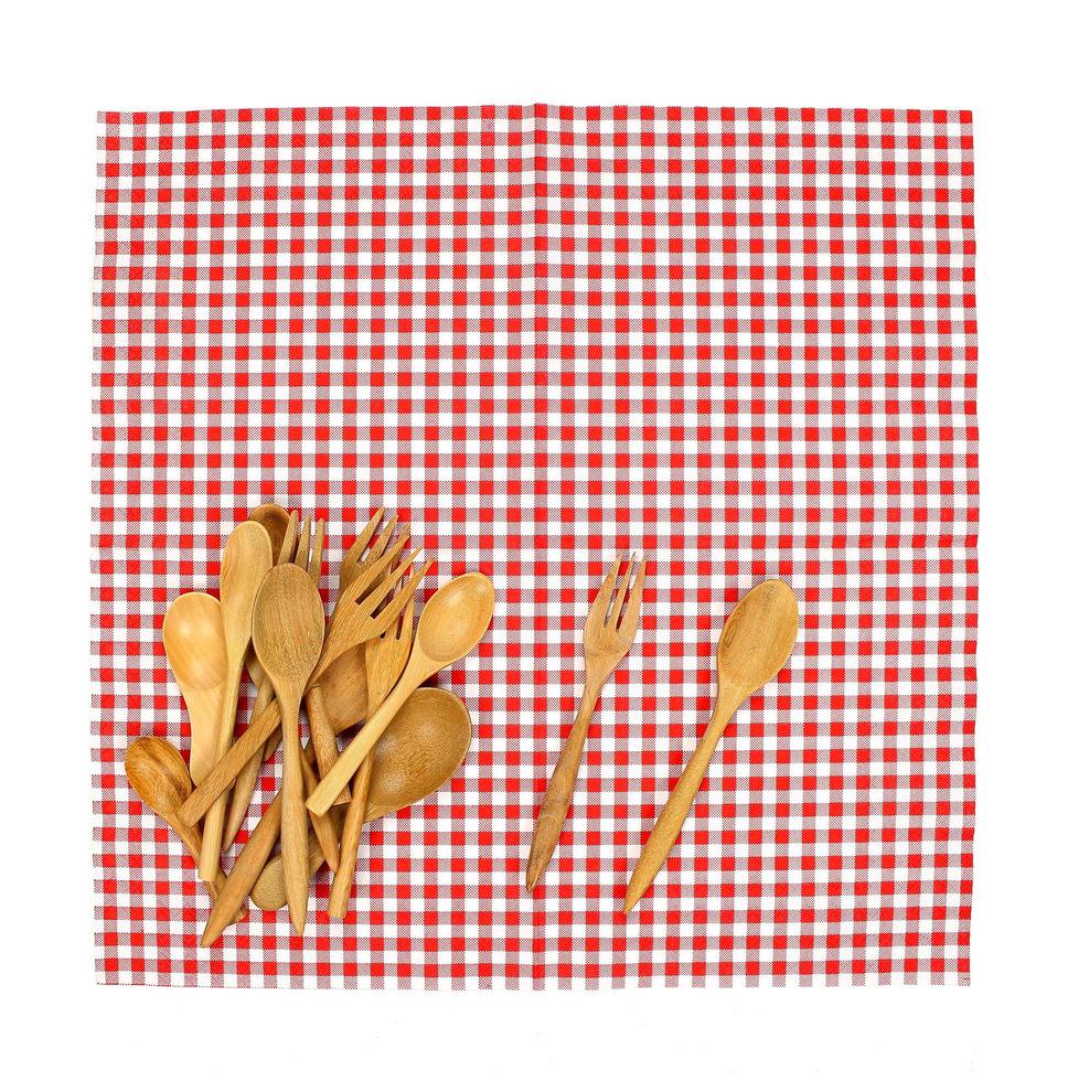 Wooden utensils on red cloth photo