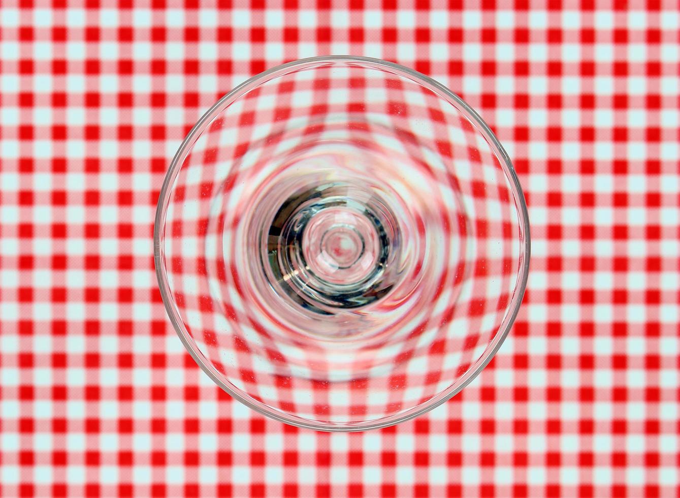 Glass on tablecloth photo