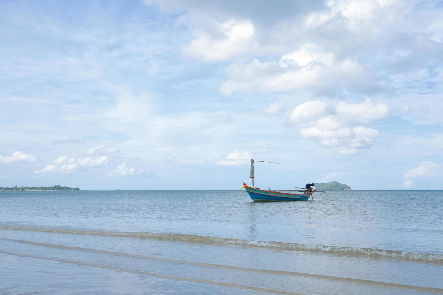 Small fishing boat at the beach photo