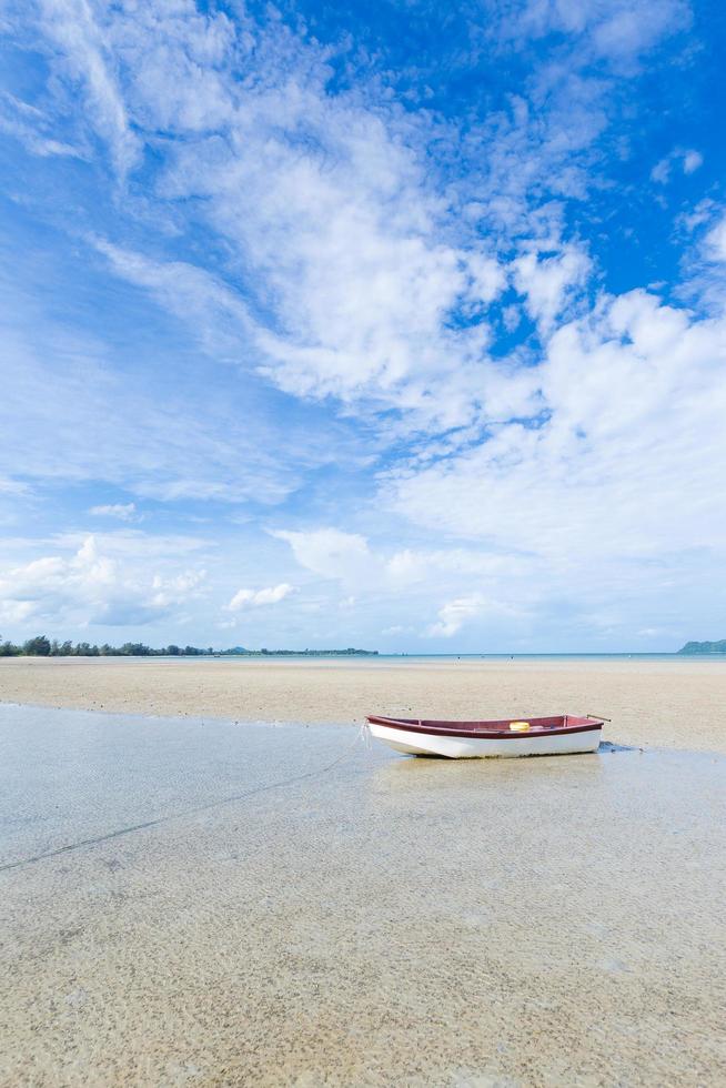 Small boat on the beach photo