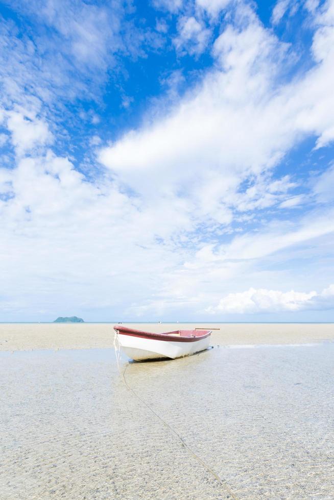 Small boat on the beach photo