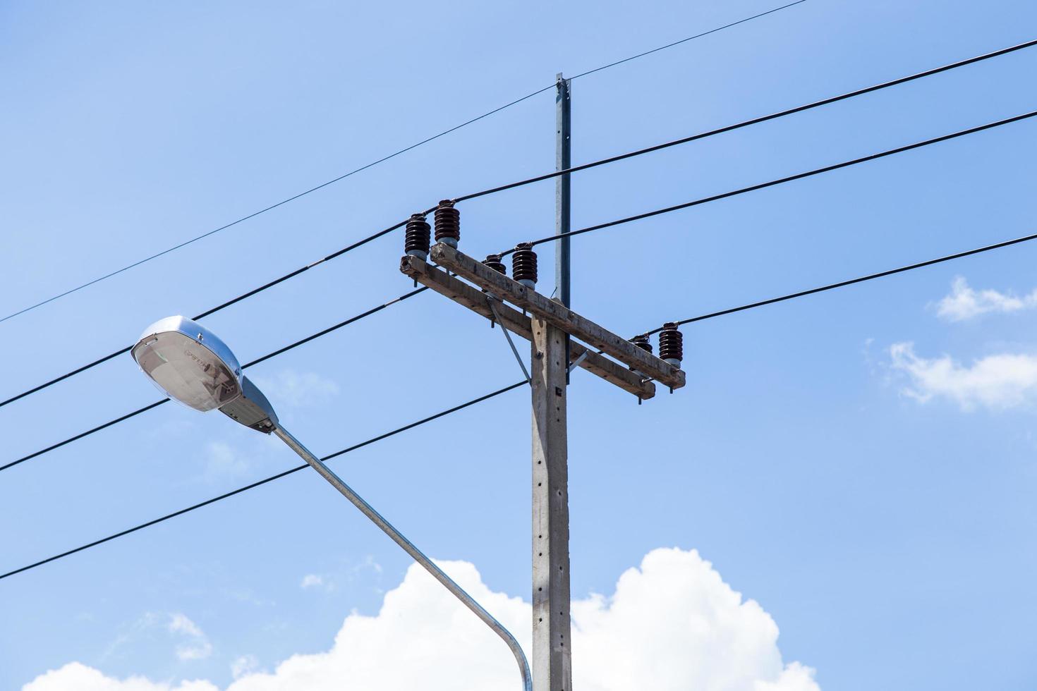 Poles and street lamp photo