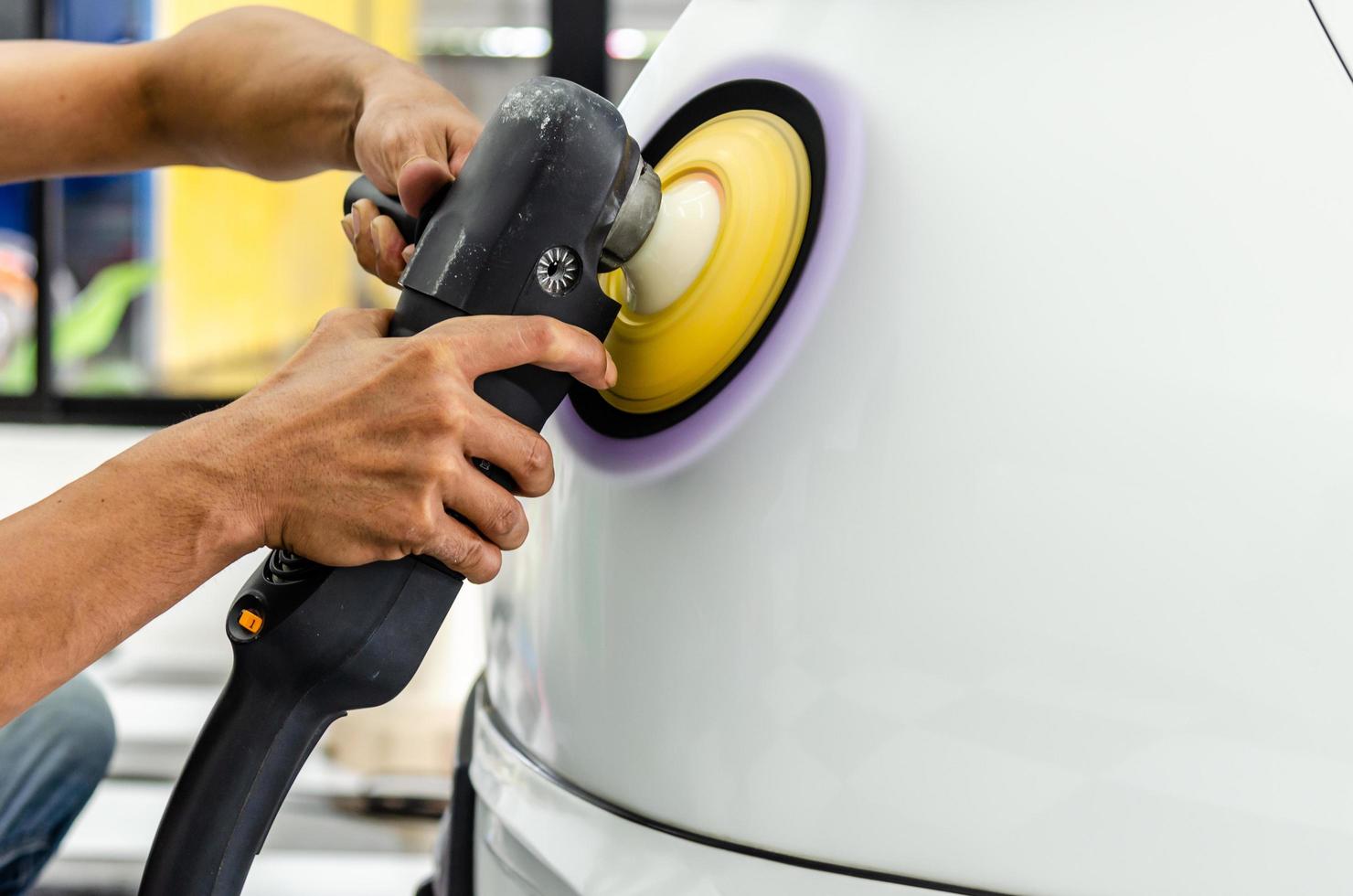 Polishing a white car photo