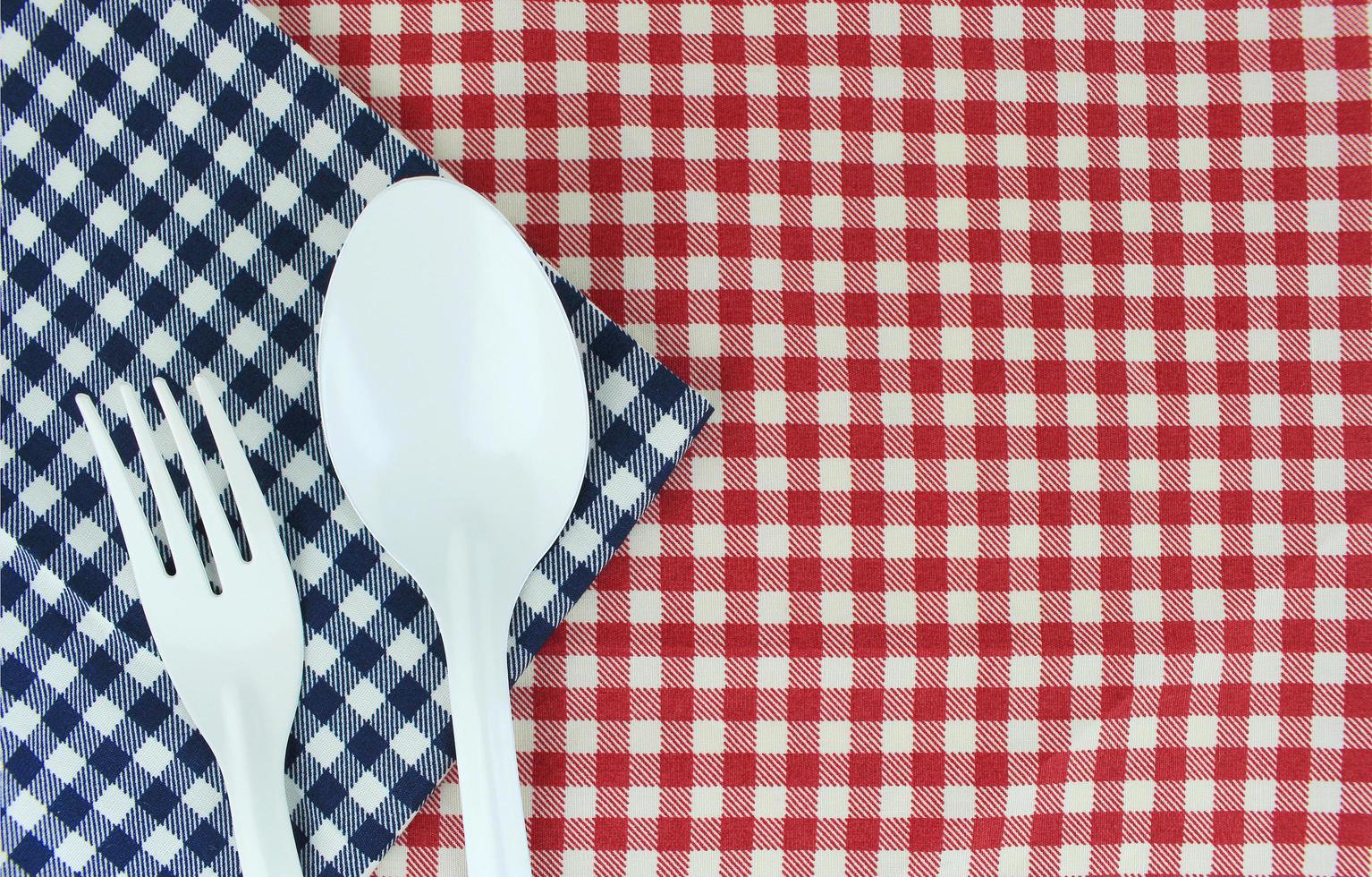 Fork and spoon on cloth photo