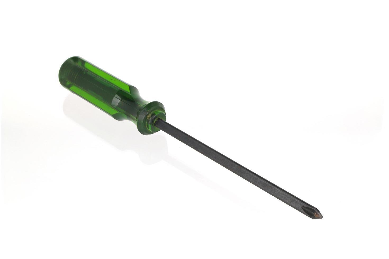 Green screwdriver on white background photo