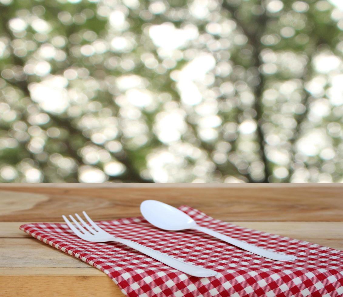 Fork and spoon on cloth outside photo