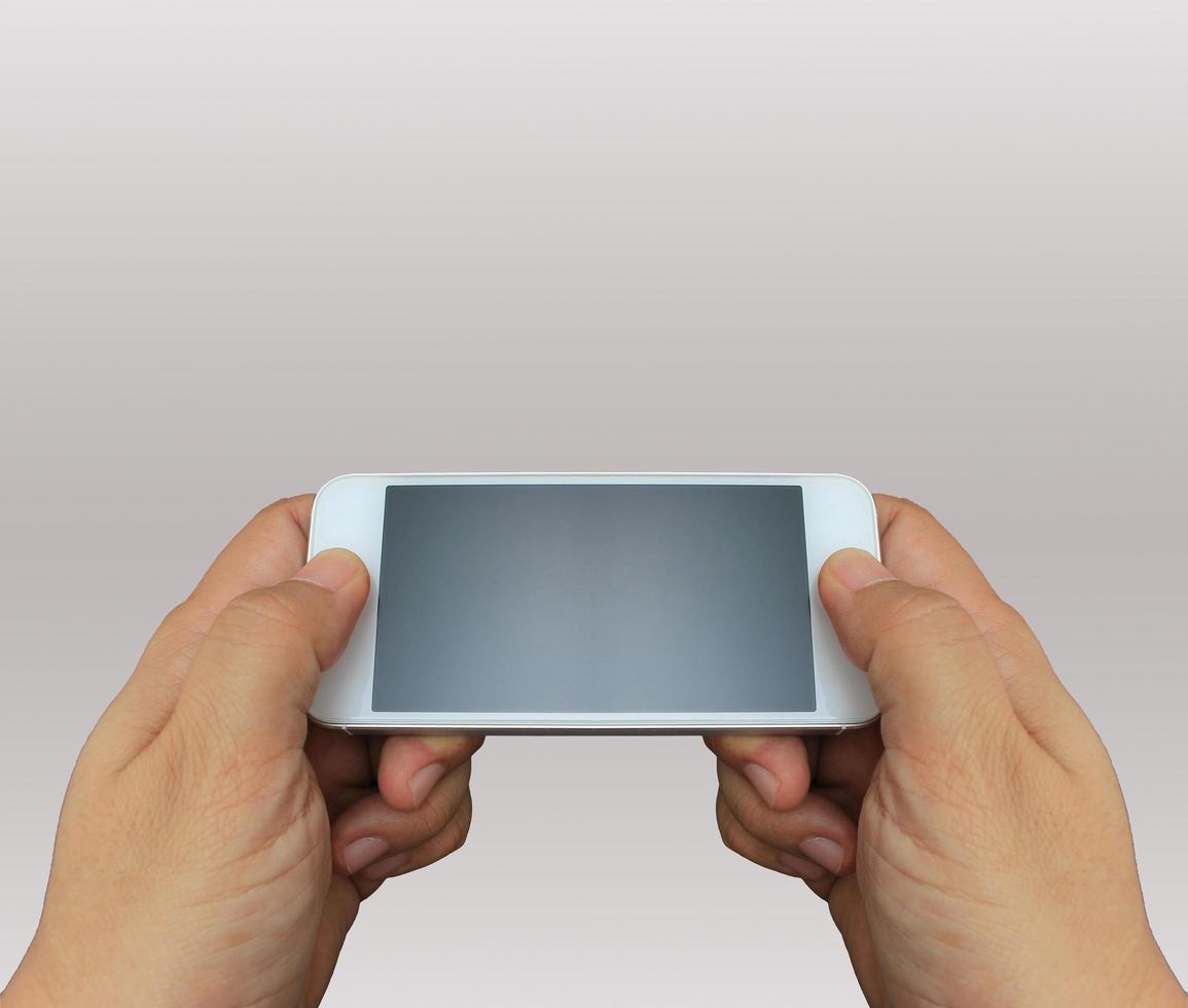 Person holding phone on side photo