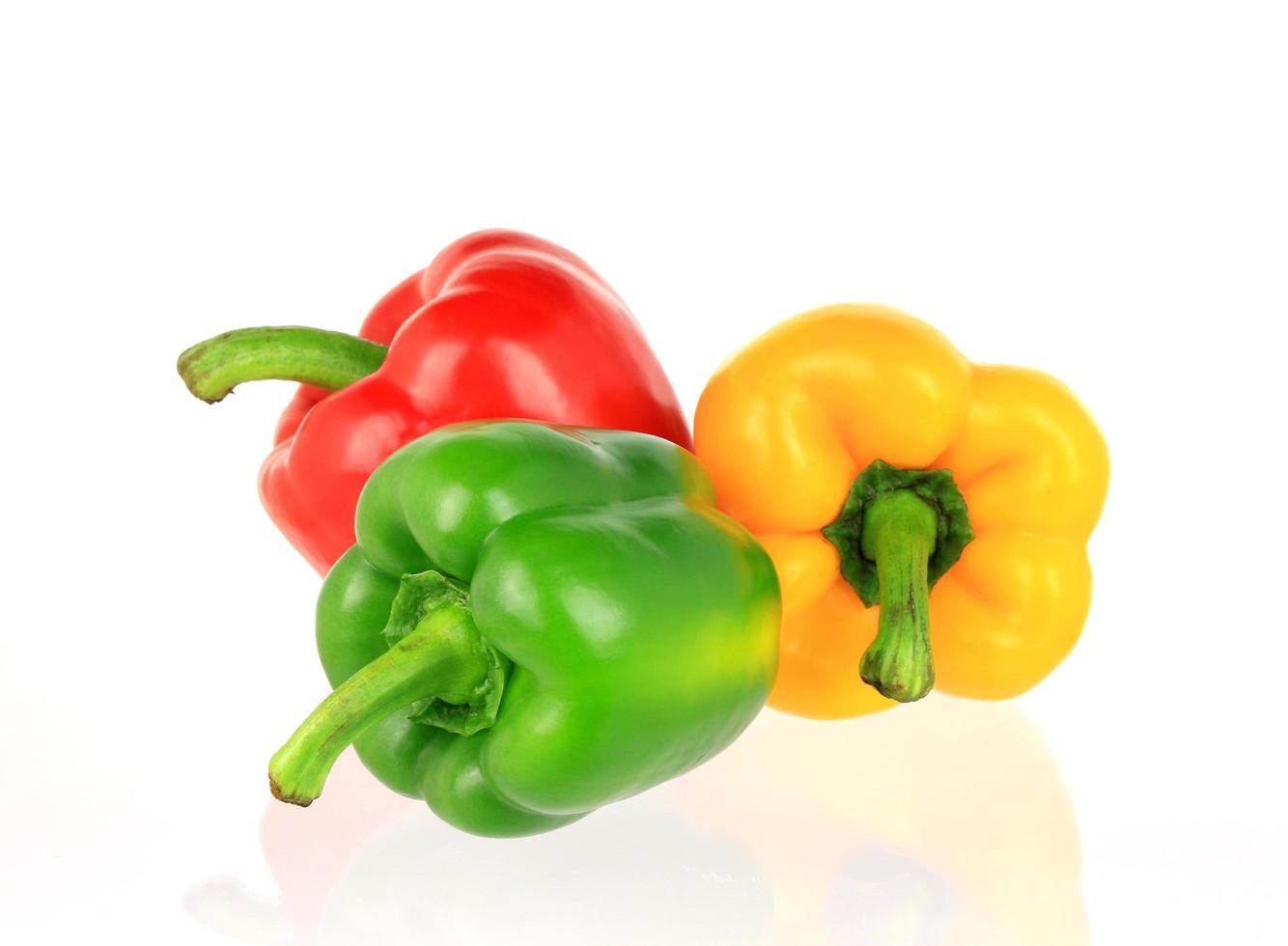 Red, green and yellow bell peppers photo