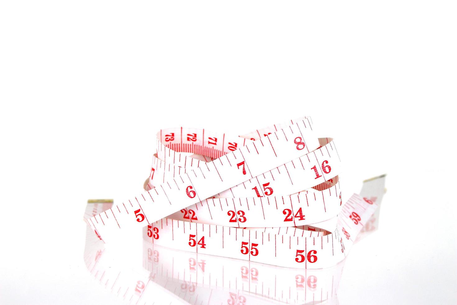 White and red measuring tape photo