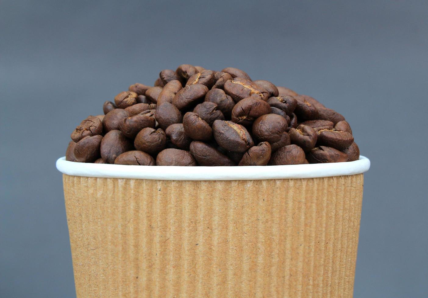 Coffee beans in cup photo