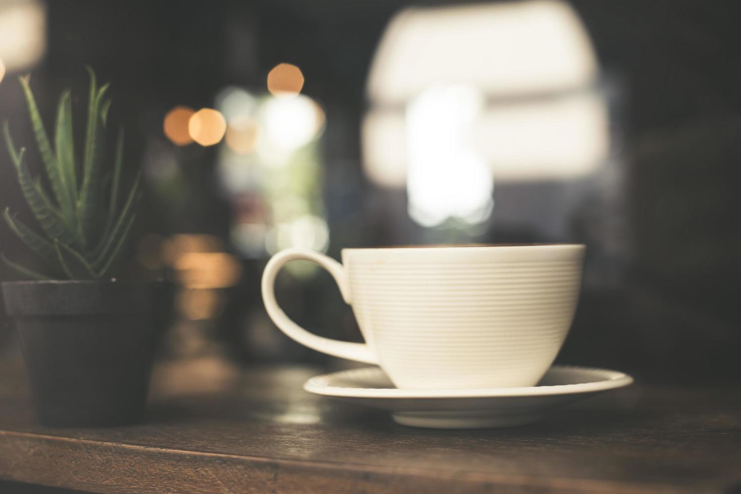 Vintage tone cup of hot latte photo