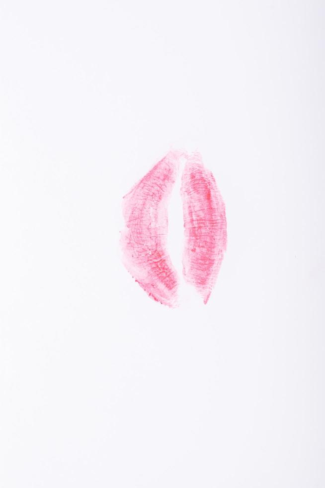 Pink lips print on a white background photo