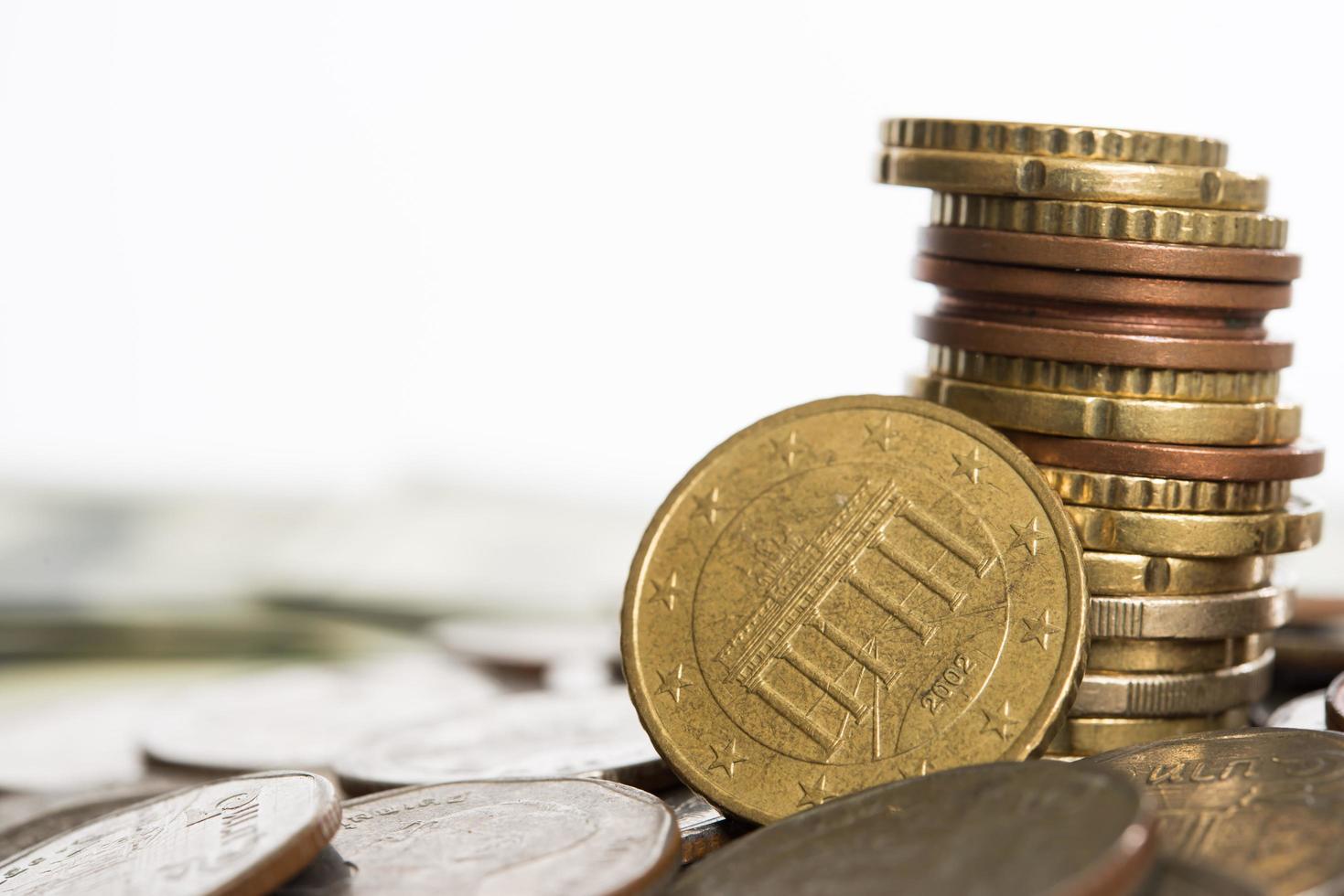 Stacks of coins isolated on white background photo