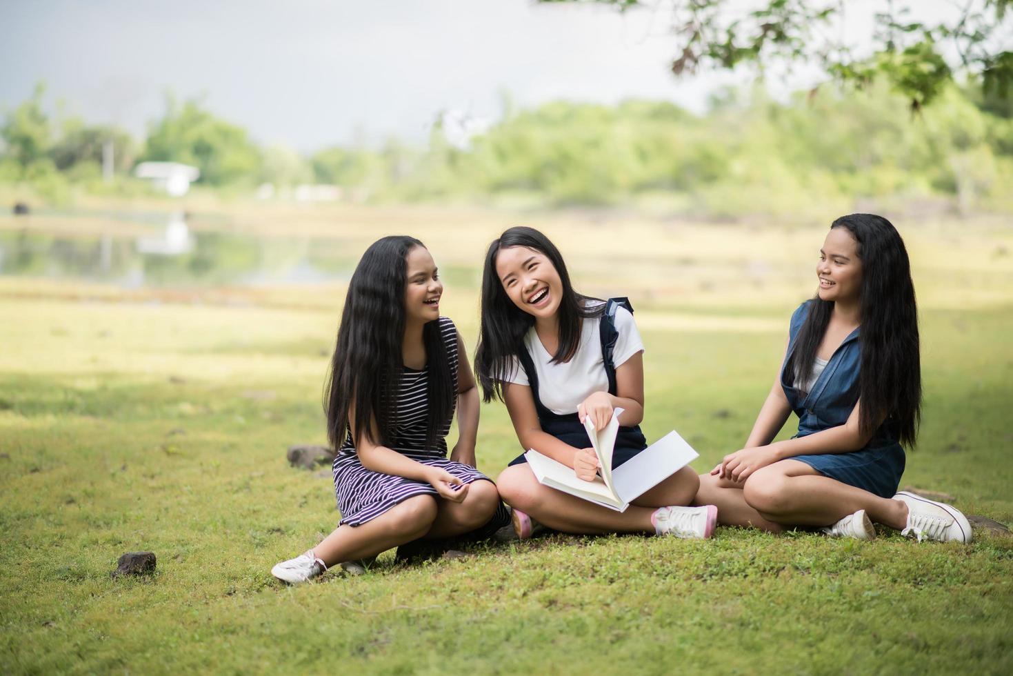 Young female students prepare for an exam in the park photo