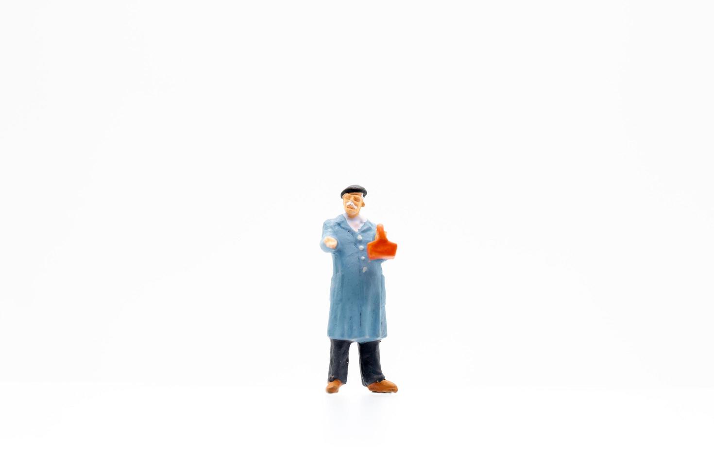 Miniature man on white background photo