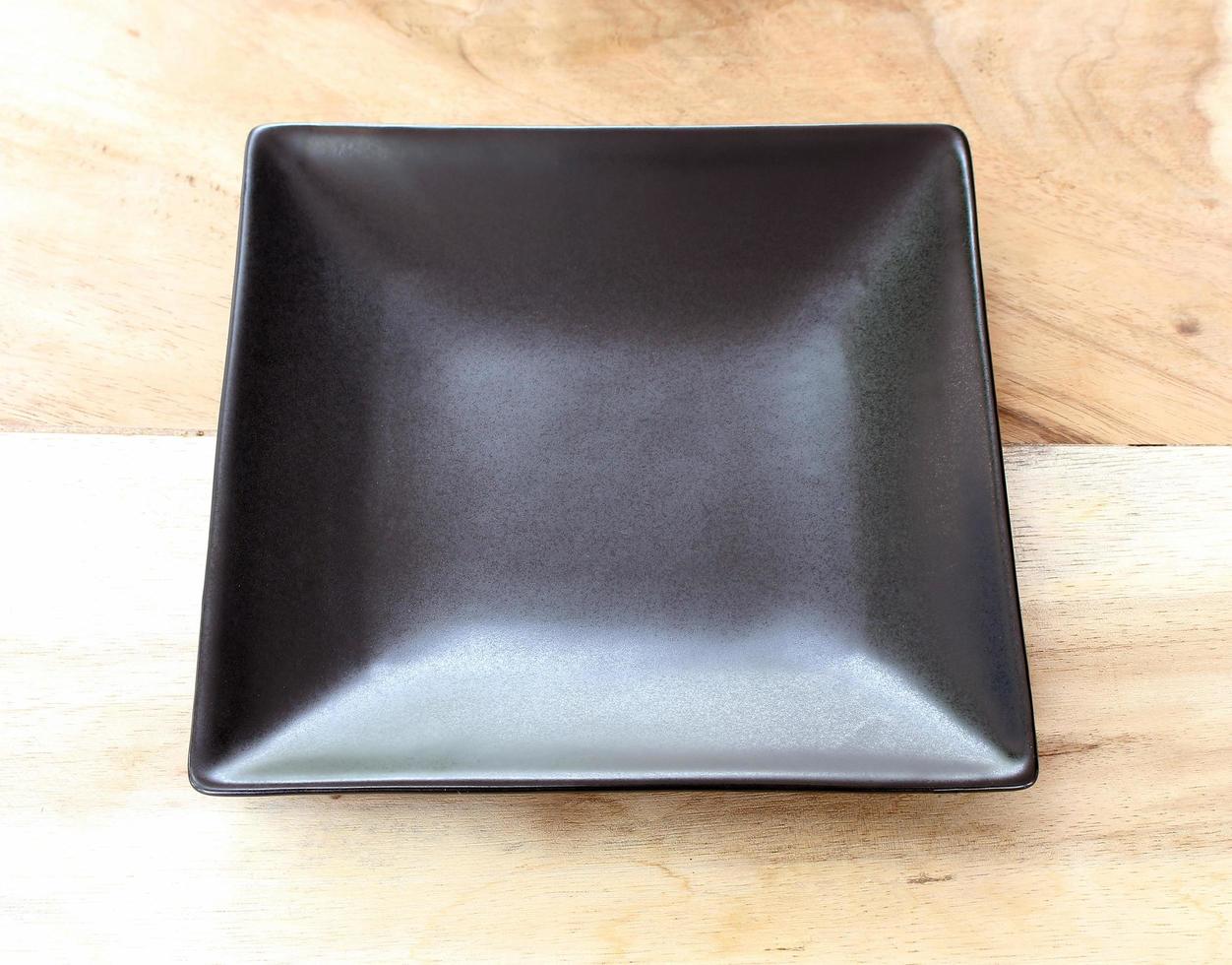 Black plate on table photo