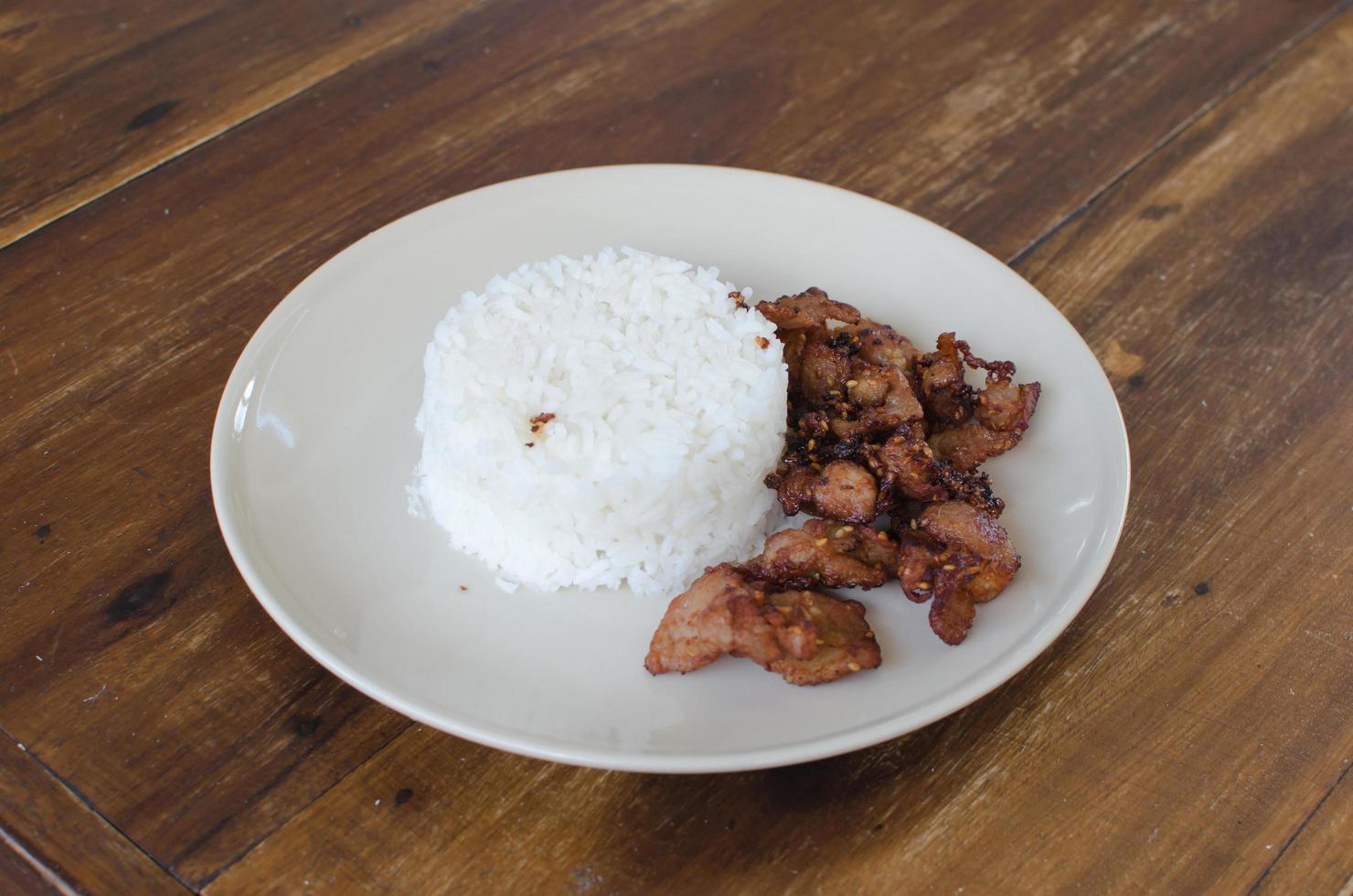 Fried pork with white rice photo