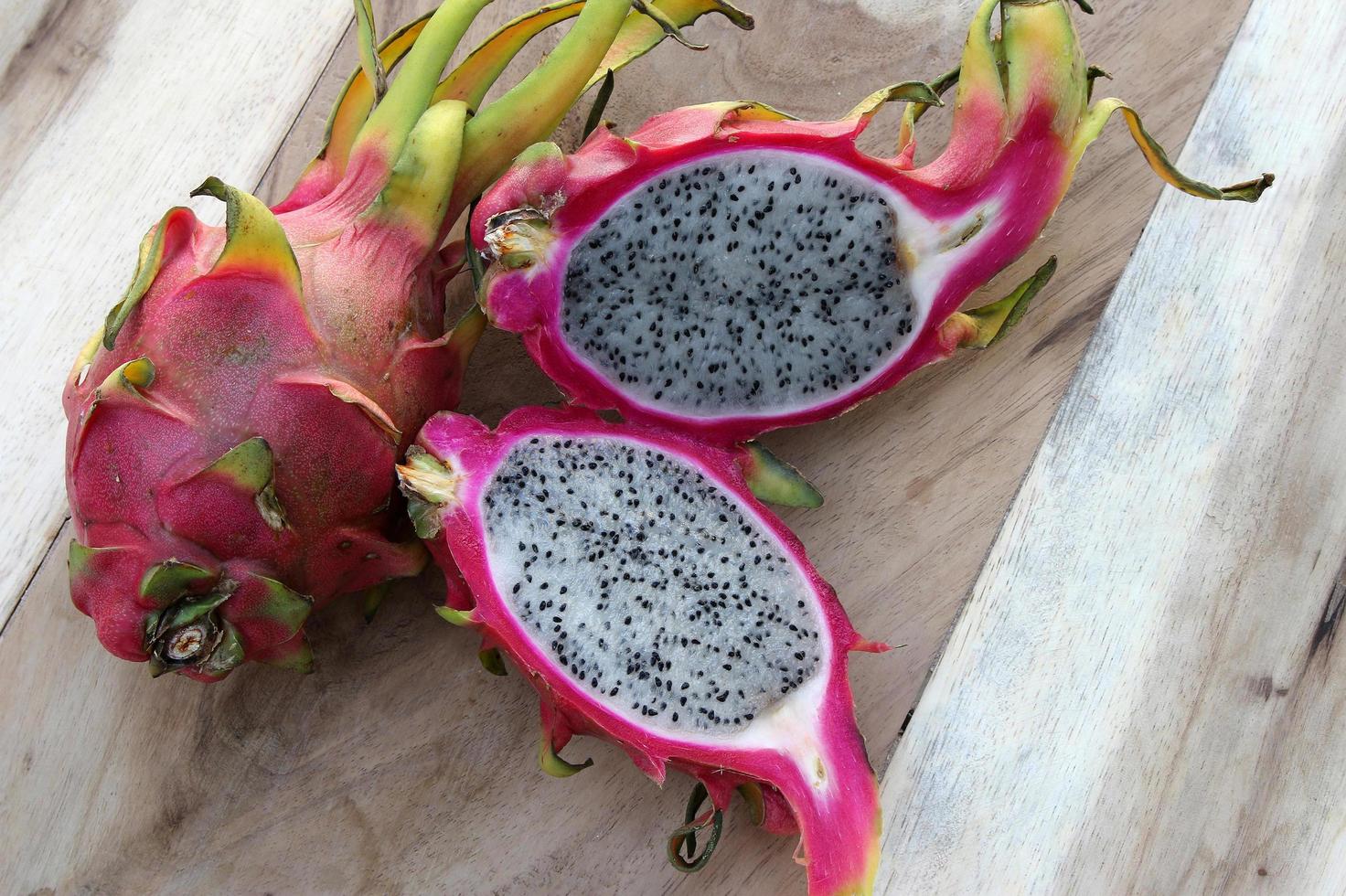 Dragon fruit on wooden table photo