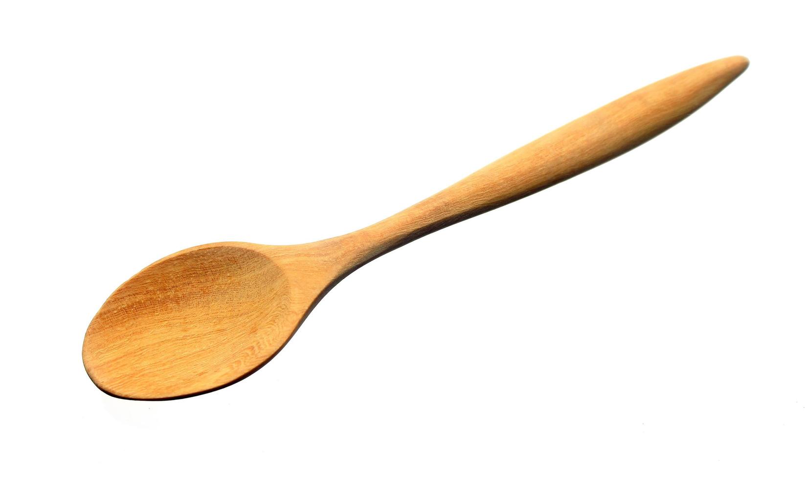 Wooden spoon isolated on white background photo