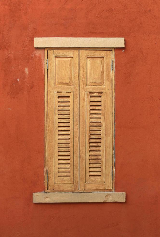 Wood window on red wall photo