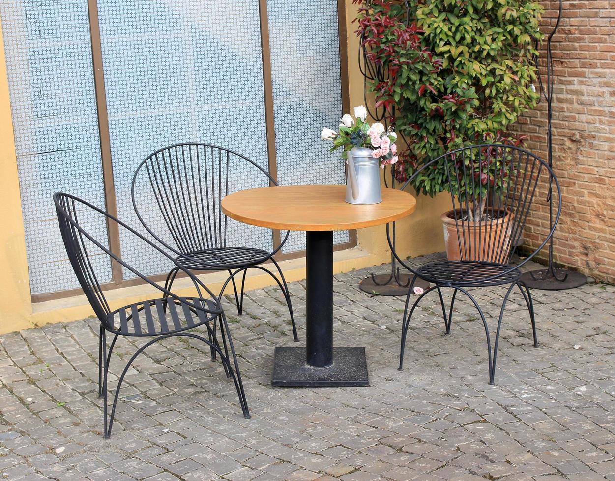 Outdoor table with flowers photo